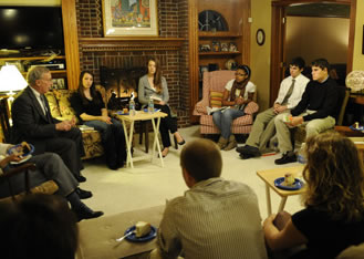 Students discuss Jeffrey Sachs’ “The End of Poverty” in the living room of Michael Mogavero of the Department of Economics