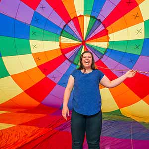 May 6, 2016; Student Kiley Adams who has synesthesia, stands inside a hot air balloon at Centennial Park in Plymouth, Indiana. (Photo by Barbara Johnston/University of Notre Dame)