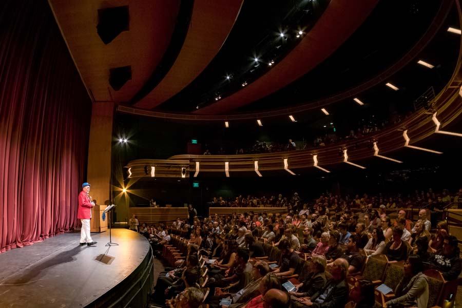 Juan Felipe Herrera takes questions from the audience following a reading of his poetry in the Decio Theater at the DeBartolo Performing Arts Center.