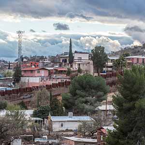 January 7, 2016; A metal wall, as seen from Arizona, marks the international border between Nogales, Arizona, USA, and Nogales, Sonora, Mexico. (Photo by Barbara Johnston/University of Notre Dame)