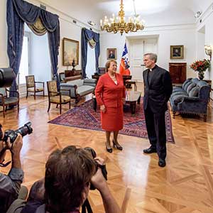 Mar. 8, 2016; President Michelle Bachelet of Chile greets University of Notre Dame President Rev. John I. Jenkins, C.S.C. at La Moneda Presidential Palace, in advance of an extended discussion between the two and Provost Thomas Burish, Vice President for Internationalization J. Nicholas Entrikin and Chilean Foreign Affairs Minister Heraldo Muñoz Valenzuela on international education and other issues. (Photo by Matt Cashore/University of Notre Dame)