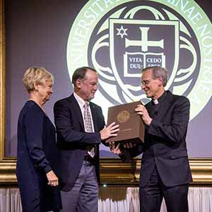 Apr. 28, 2016; University President Rev. John I. Jekins, C.S.C. presents outgoing Chairman of the Board of Trustees Richard Notebaert and his wife Peggy with a gift at a dinner in honor of Mr. Notebaert's service as chairman. (Photo by Matt Cashore/University of Notre Dame)