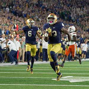 October 29, 2016; Running back Josh Adams (33) scores a touchdown against Miami. (Photo by Matt Cashore)