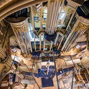 August 9, 2016; Professional riggers from Organ Clearing House hoist a pipe to the choir loft to install in the organ. (Photo by Barbara Johnston/University of Notre Dame)