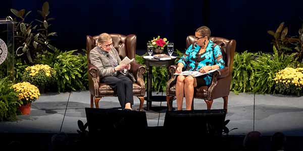 United States Supreme Court Justice Ruth Bader Ginsburg reads from a pocket copy of the United States Constitution during a conversation with U.S. Court of Appeals Judge Ann Claire Williams