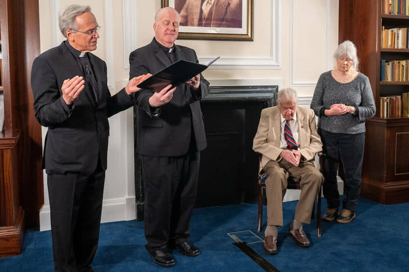 University of Notre Dame President Rev. John I. Jenkins, C.S.C., prays at the dedication and blessing, assisted by Rev. Jim Lies, C.S.C. Also in attendance at the ceremony was Aidan Mackey, and his daughter Patricia.