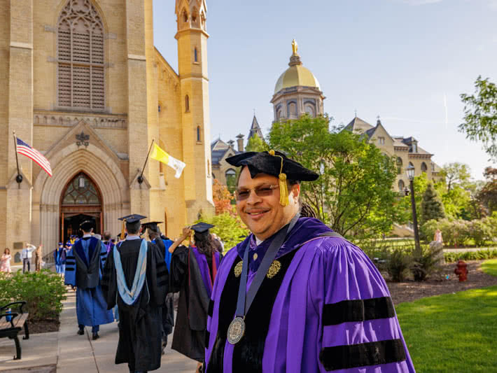 Group of faculty and students walking into the Basilica to start prayer service.