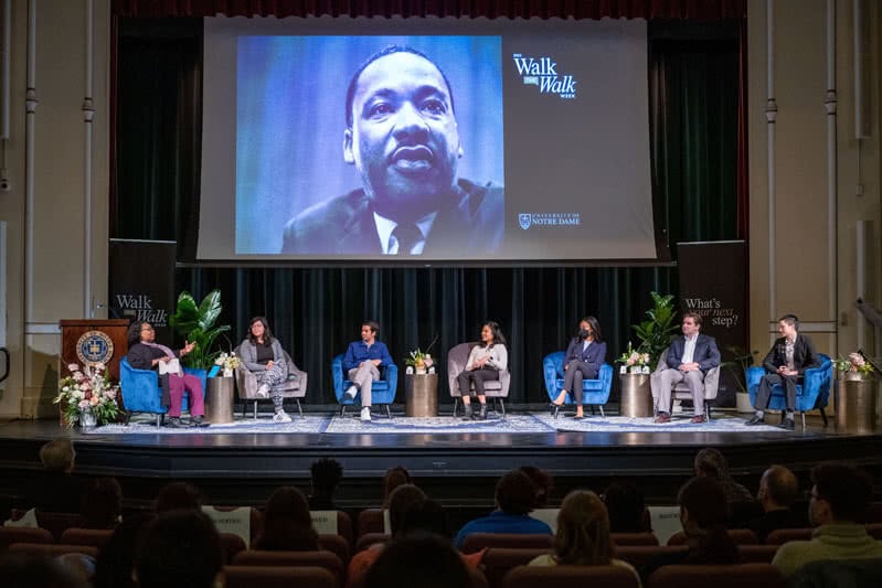 Members sitting on stage for a topical discussion