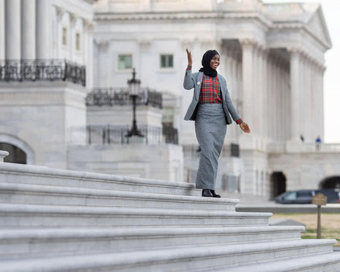 Student standing on the steps of the Capitol Building in Washington, D.C..