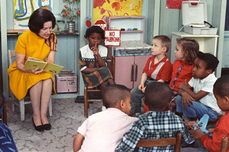 Lady Bird Johnson reading to a classroom full of children for Project Head Start, 1966.