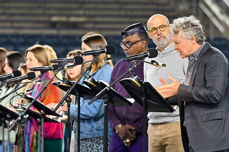 Film and TV actor Tate Donovan, right, reads from the ancient Greek tragedy ‘The Suppliants’