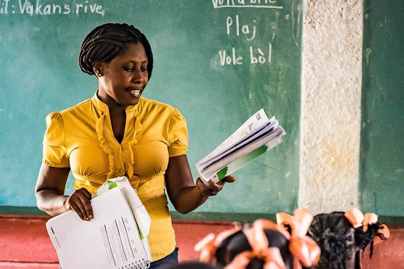 A teacher in a classroom in Haiti