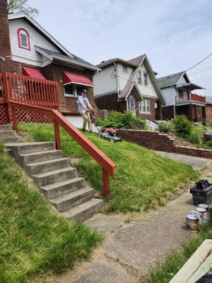 A man mows a lawn.