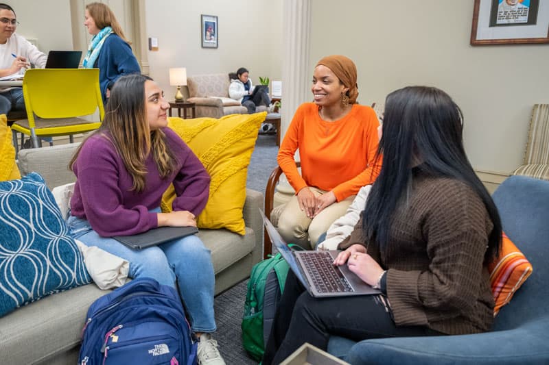 Three students sitting in the new DEI space in LaFortune.