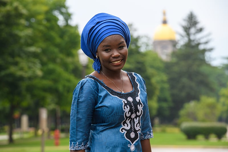 Dinah standing in front of the golden dome.