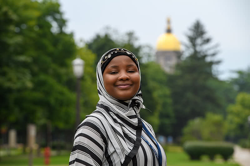 Laila standing in front of the golden dome.