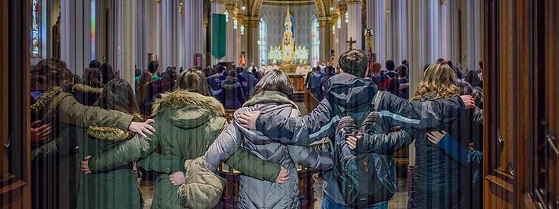Students face the alter in the Sacred Heart Basilica, linking arms. A barcode texture is on the photo.
