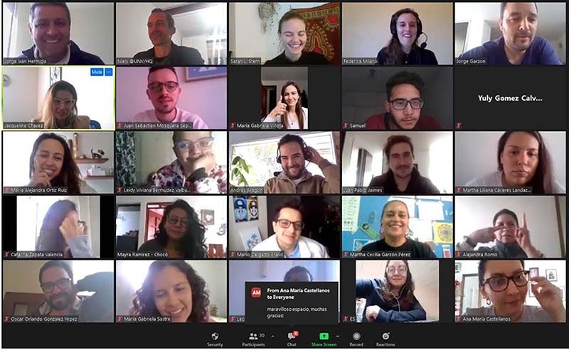 Individuals on a Zoom video call; smiling, laughing and gestering.
