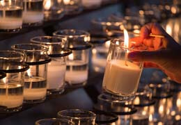 Lighting a candel at the Grotto.