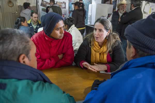 People conversing around table