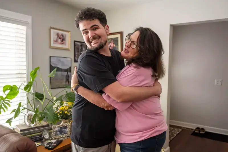 Alec Koujaiain hugging his mom Gail.