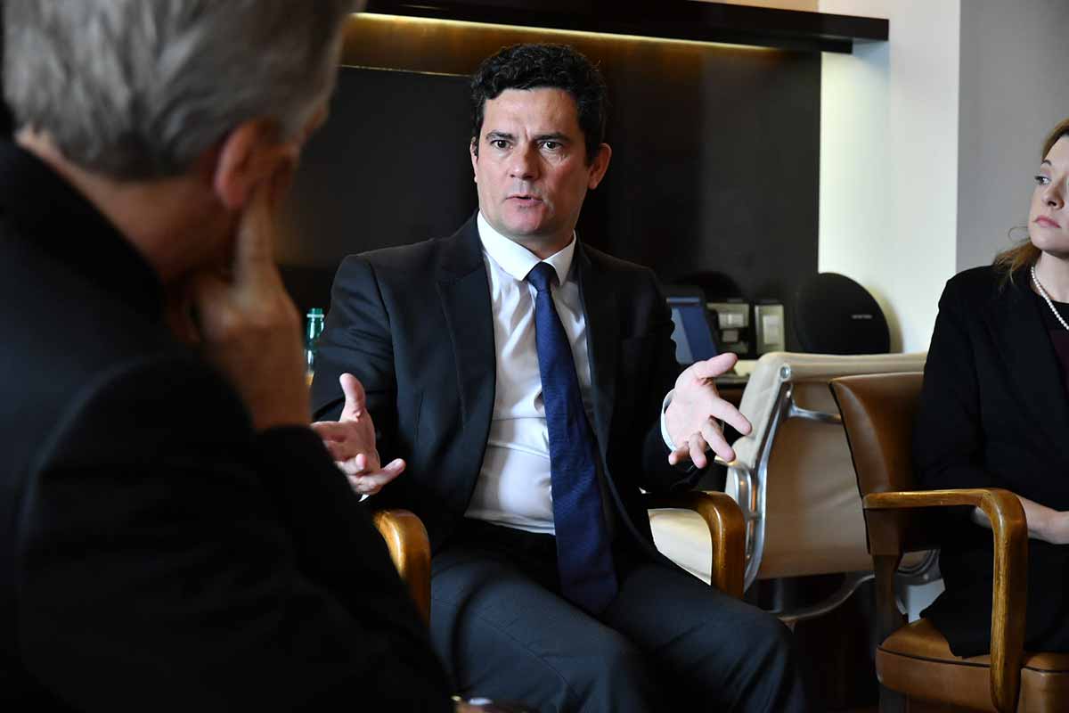 Notre Dame Award recipient Sergio Moro speaking with University president Rev. John I. Jenkins, C.S.C.