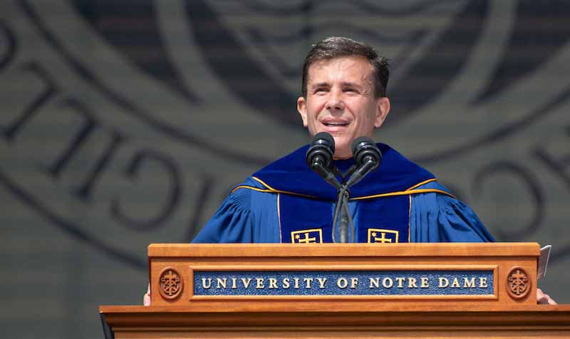 John Crowley speaks at a podium.