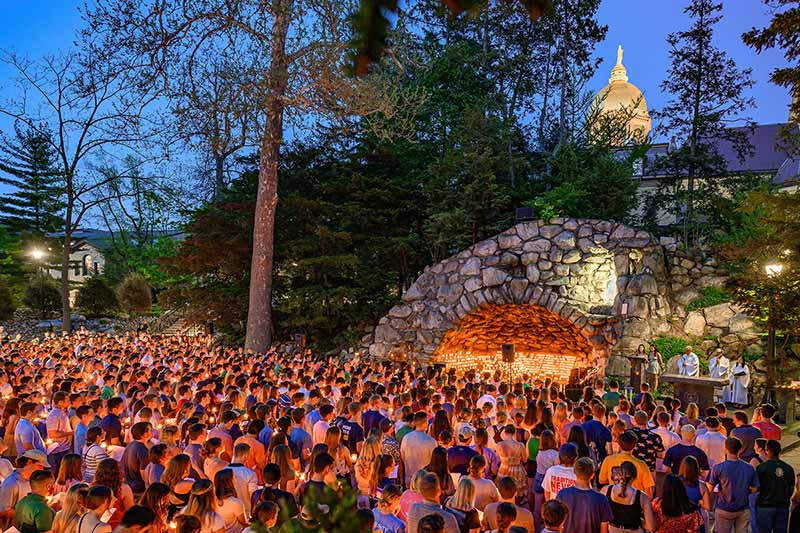 A large group of Notre Dame seniors gather at the Grotto for a prayer service during Senior Week 2022.