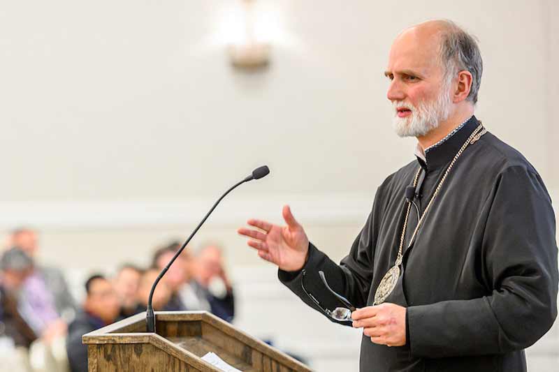 Archbishop Borys Gudziak, Archeparch of the Ukrainian Catholic Archeparchy of Philadelphia, standing in front of a podium. 