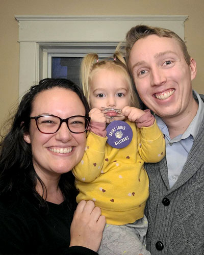 Abby, on the left, poses with her daughter and her husband (on the right).