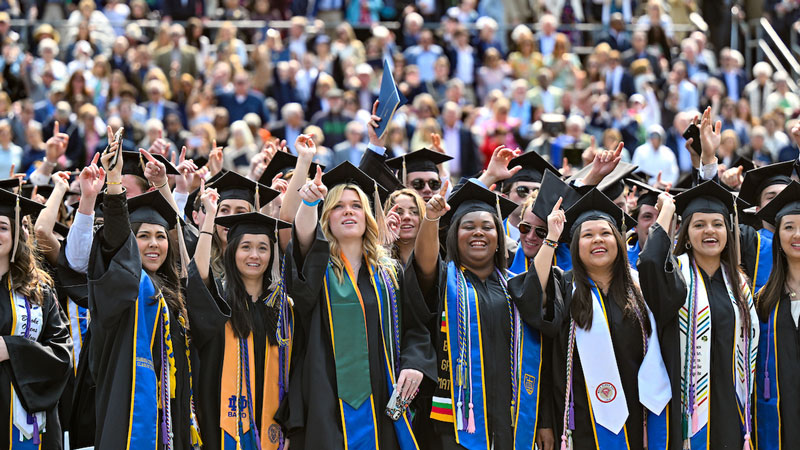 A crowd of Notre Dame graduates in their caps and gowns.