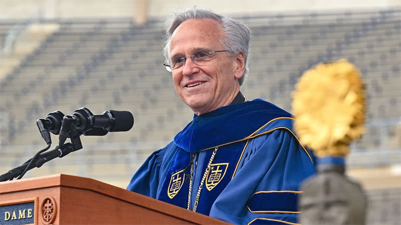 Fr. John I. Jenkins speaking at the podium giving his charge to the class of 2023.