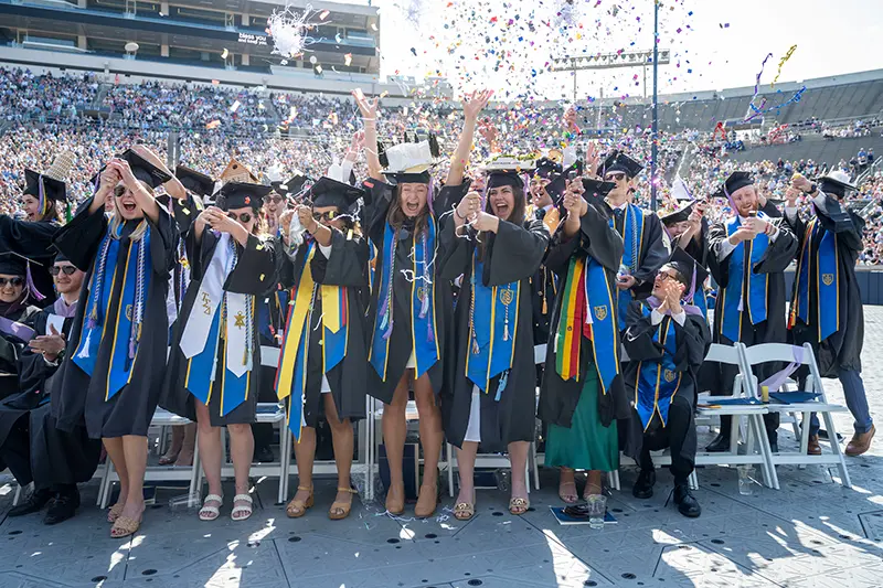 New graduates celebrate after the commencement ceremony.