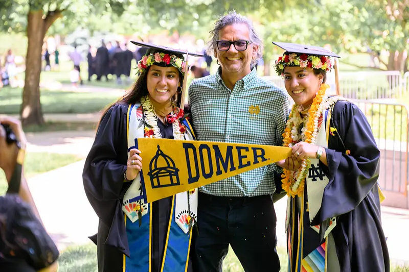 Graduates pose for photos on Main Quad after the 2024 Commencement Ceremony.