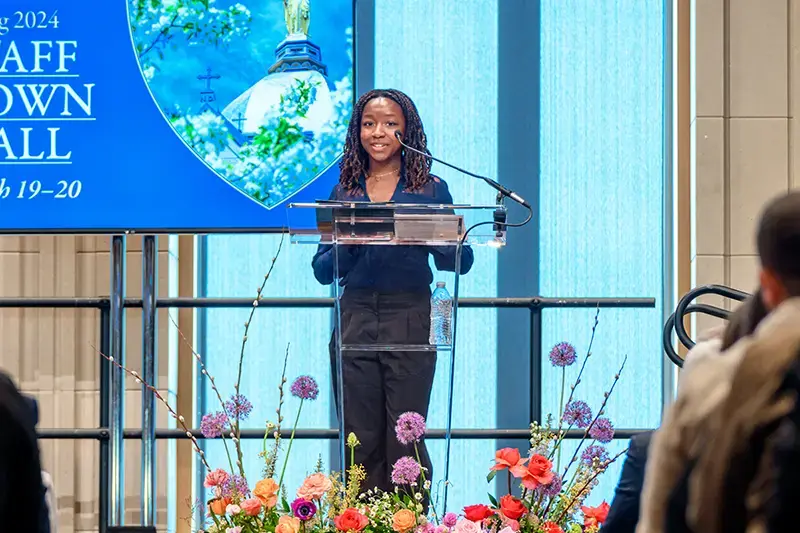 Joy Agwu stands at the podium at the Notre Dame town hall.