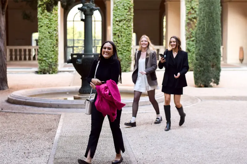 Elizabeth Gonzalez and two female classmates on a street in Rome