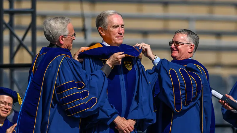 Jack Brennan receives an an honorary doctor of laws at the 2024 Commencement ceremony in Notre Dame Stadium. Brennan was also honored with the Hesburgh-Stephan Medal.