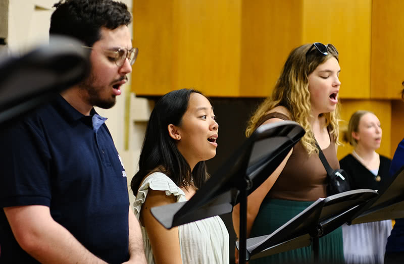 Vocalists singing during a recording session