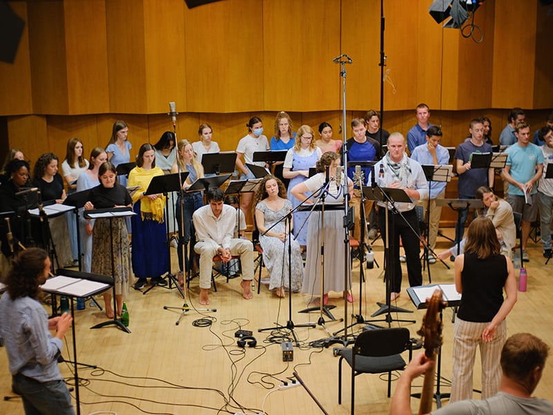 Vocalists standing during a recording session