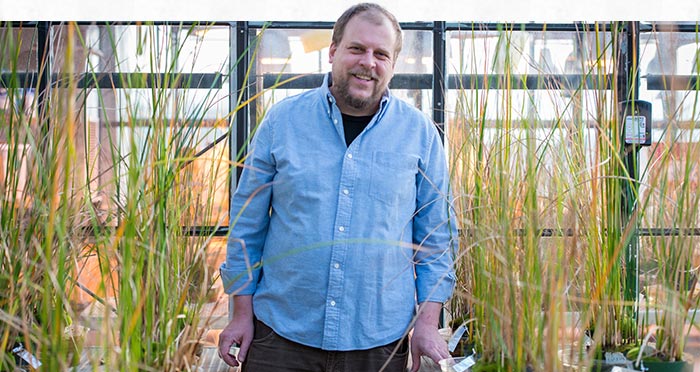 Jason McLachlan surrounded by plants