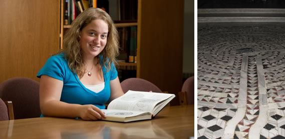 Maria Martellaro sitting at a desk with a book