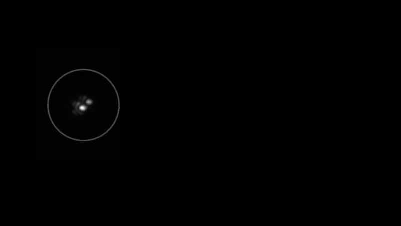 Two stars glow against a pitch black sky.