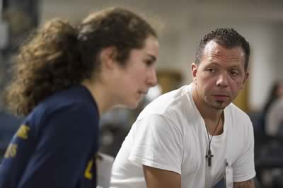 David, an inside student, listens intently to a Notre Dame student discussing privilege and power.