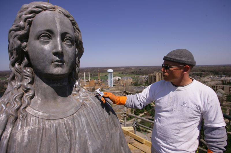 A close up of the statue of Mary's face at the top of the Dome. All of the gold is stripped off down to the metal of the statue.