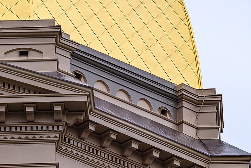 The flawless newly painted building and regilded golden dome surface.