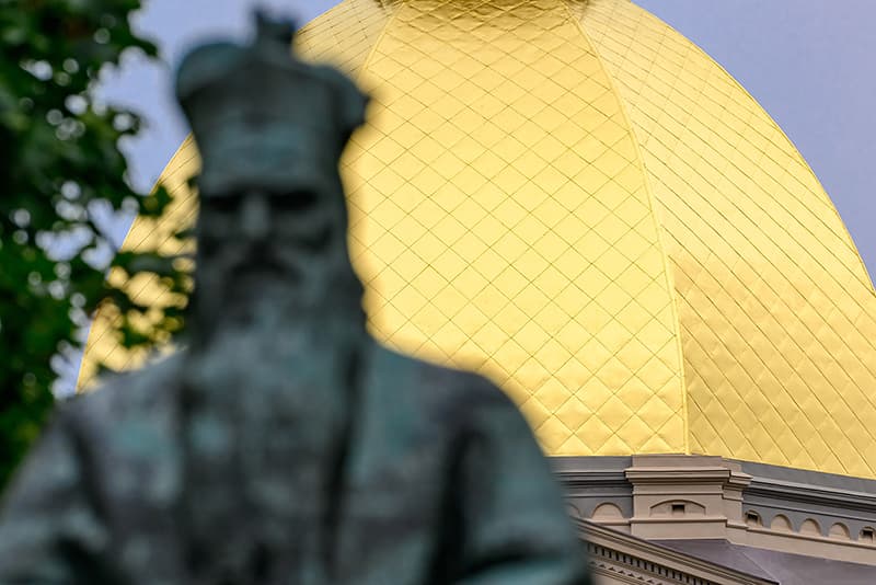 With the Sorin statue in the foreground, a clear view of the newly regilded dome can be seen over Fr. Sorin's shoulder.