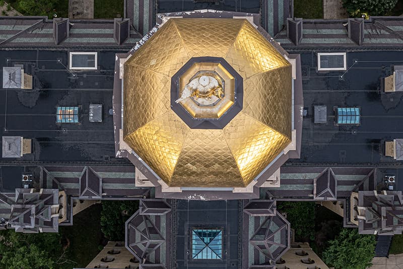 An aerial view of the Dome from directly above showing weathered gold and missing paint.