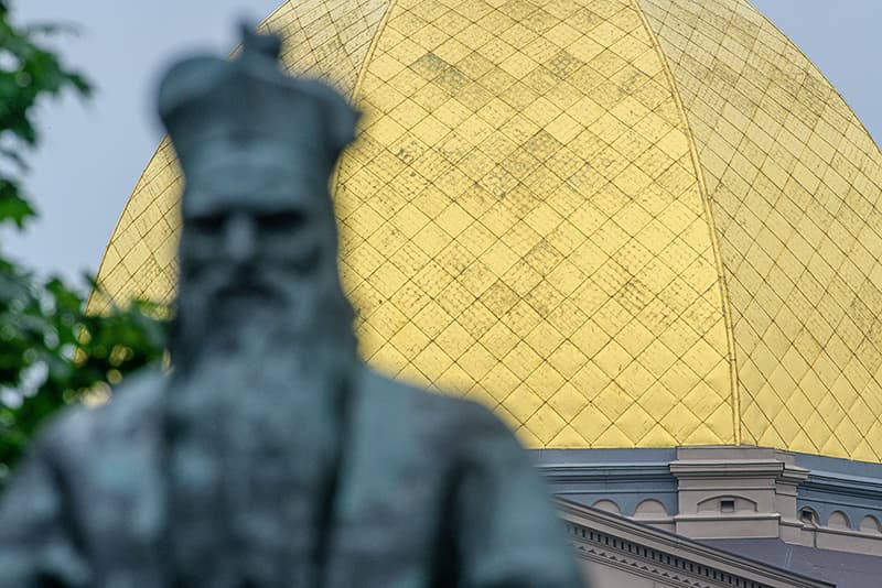 With the Sorin statue in the foreground, a clear view of the weathered dome can be seen over Fr. Sorin's shoulder.