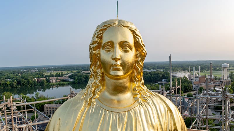 A close up view of a newly gilded Mary's face.