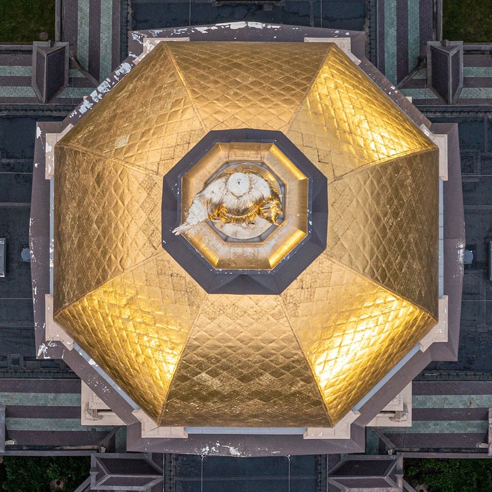 Aerial view from directly above Mary pointed down showing paint chips and weathering of the top of the dome.